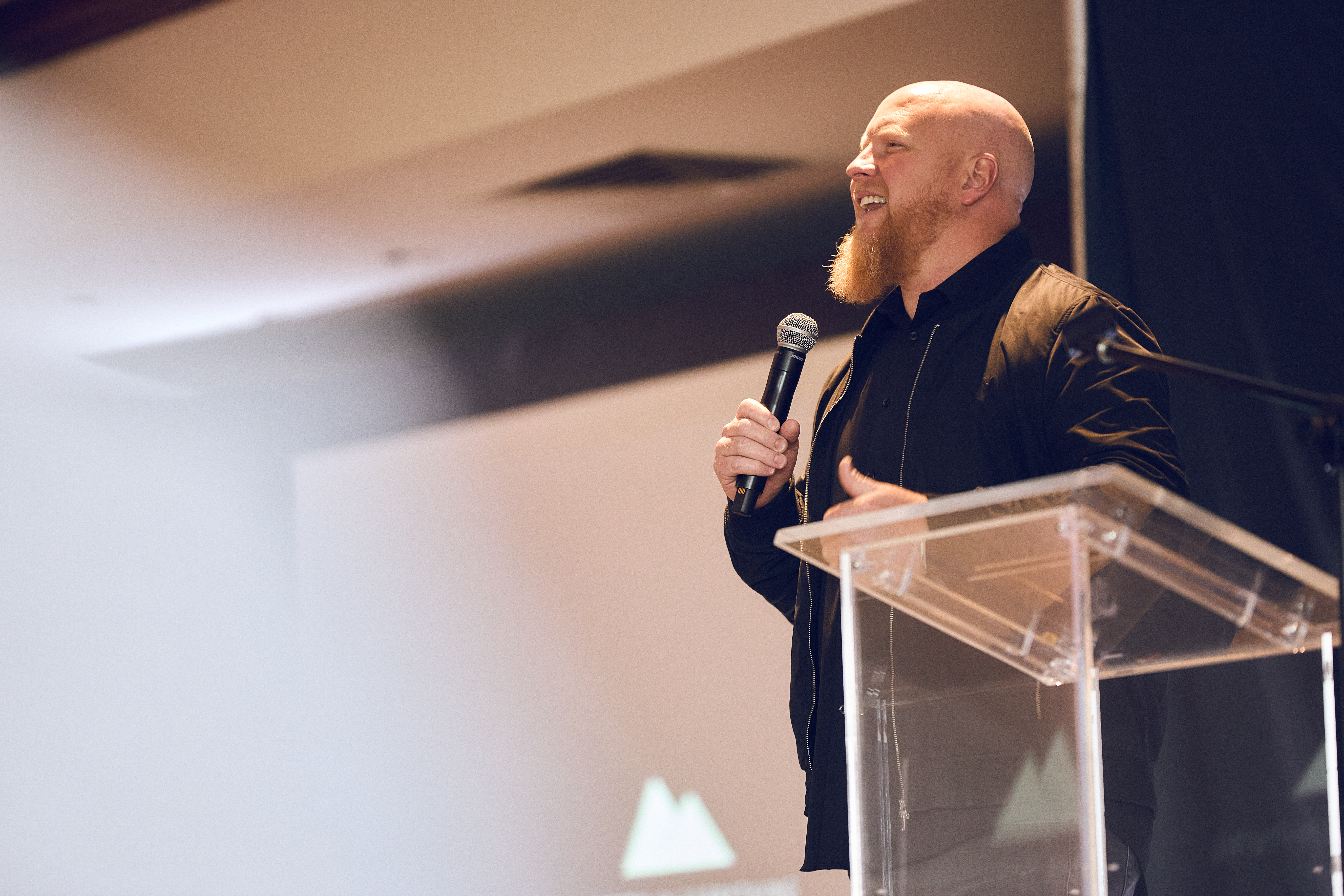 Jonathan Reynolds speaking on stage